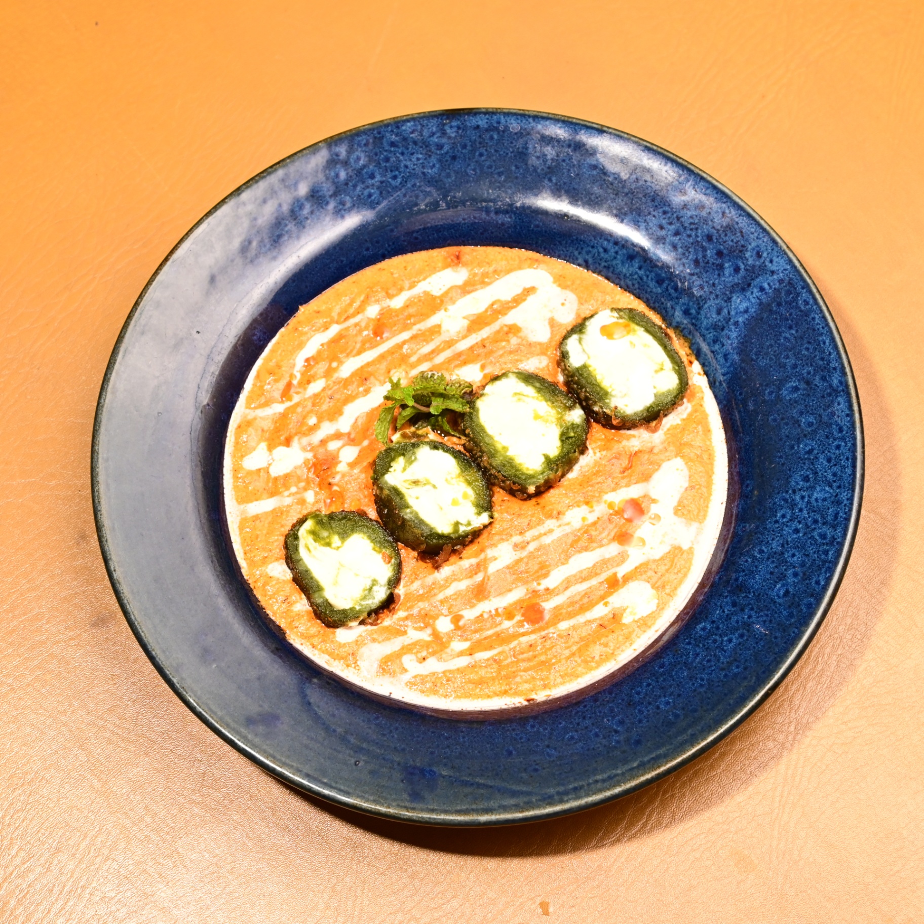 Stuffed chilli in creamy makhani gravy